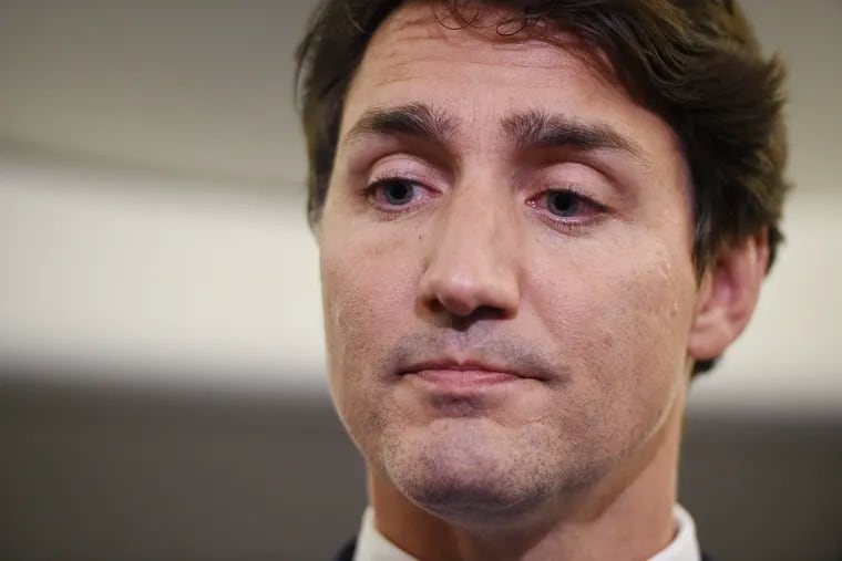 Canadian Prime Minister and Liberal Party leader Justin Trudeau reacts as he makes a statement about a photo coming to light of himself from 2001 wearing brownface.