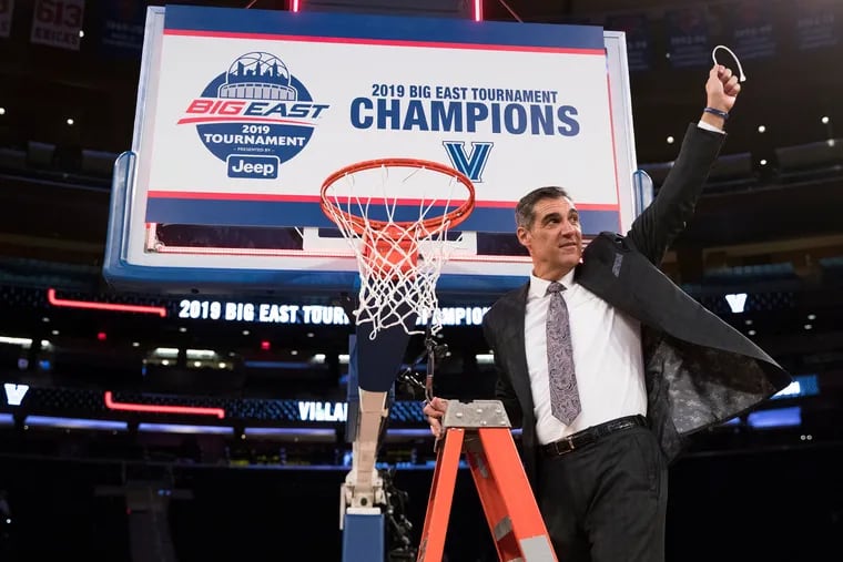 Coach Jay Wright of Villanova holds up a piece of the net after defeating Seton Hall during the Big East Tournament Championship on March 16, 2019.