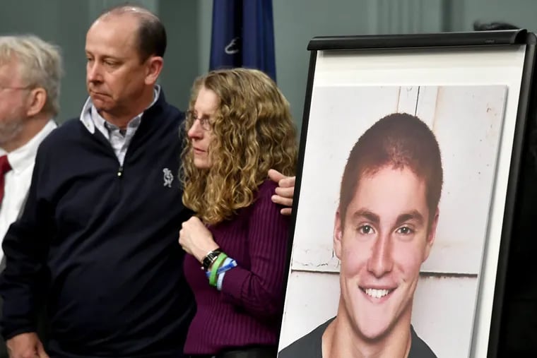 The law is named after Timothy Piazza (in blown-up photo), son of Jim and Evelyn Piazza (center). Timothy Piazza was a University of Pennsylvania student who died in 2017 after an alcohol-fueled fraternity party at which hazing is alleged.
