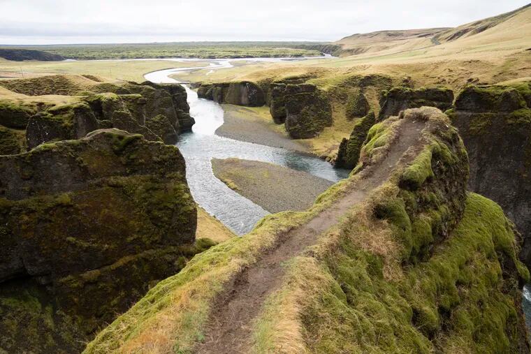 This photo taken Wednesday, May 1, 2019, shows a cliff at the Fjadrárgljúfur canyon in southeastern Iceland. The canyon area has suffered environmental damages after intense traffic, prompted by the music video "I'll Show You" by Justin Bieber. (AP Photo/Egill Bjarnason)