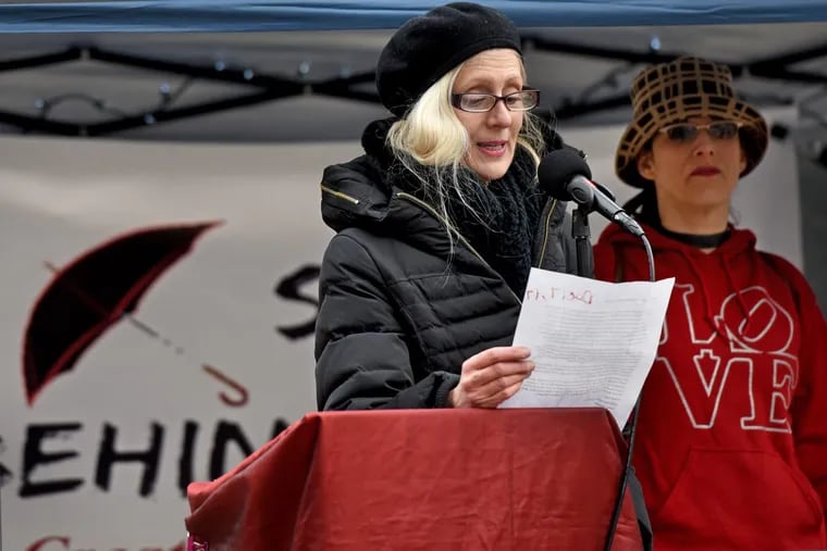 Saying her cousin was a murdered sex worker, Anita DeFrancesco spoke at the 14th annual International Day to End Violence Against Sex Workers vigil in Philadelphia Sunday. Organizers, including Melanie Dante, right, read the names of 34 sex workers killed in the U.S. this year.