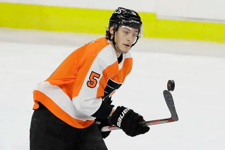 Flyers defenseman Philippe Myers uses his stick to control the puck against the Pittsburgh Penguins on Jan. 13.