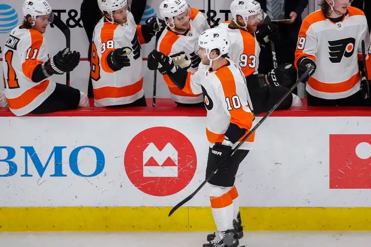 Philadelphia Flyers center Corban Knight (10) celebrates with teammates after scoring against the Chicago Blackhawks during the first period of an NHL hockey game Thursday, March 21, 2019, in Chicago. (AP Photo/Kamil Krzaczynski)
