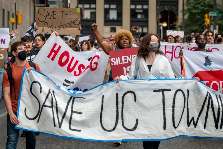 Protesters and  residents of the UC Townhomes affordable housing march around City Hall after rally in September 2022.