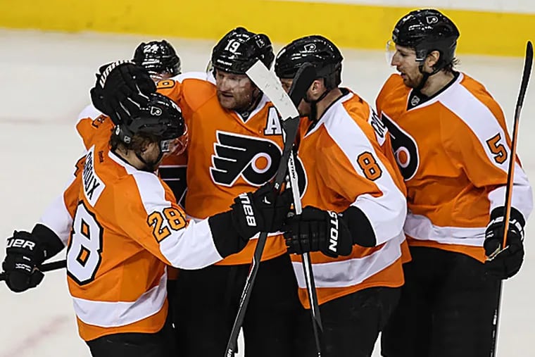 The Flyers' Scott Hartnell celebrates a goal with teammates. (Steven M. Falk/Staff Photographer)