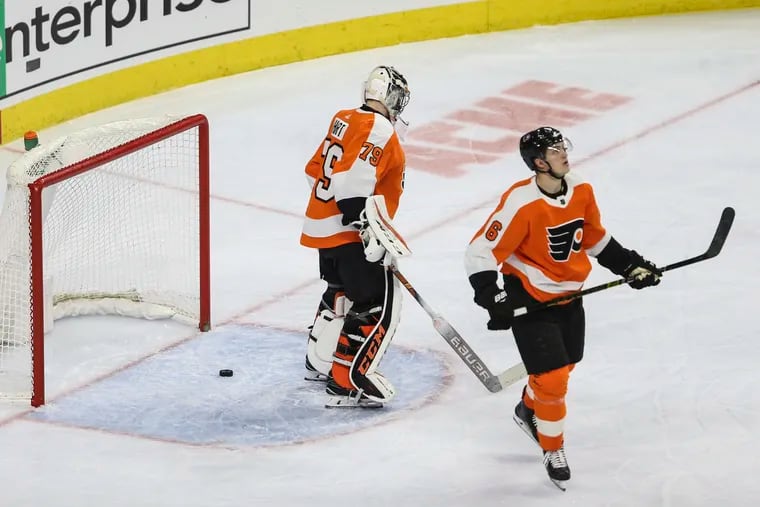 Flyers' goalie Carter Hart (left) and Travis Sanheim after Montreal's Shea Weber scored a goal during the second period on Tuesday.