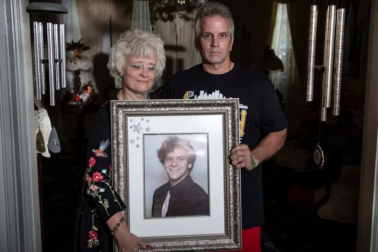 Cindy and Bernie Leech hold a portrait of their late son  Corey Leech, at their home in Johnstown, Pa. Sunday, September 17, 2018. Corey was abused by Franciscan Friar Stephen Baker at Bishop McCort H.S. in Johnstown.