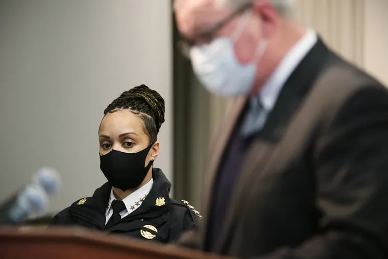 Philadelphia Police Commissioner Danielle Outlaw (left) listens as Mayor Jim Kenney speaks during a news conference about security around the date of the presidential inauguration at the Philadelphia District Attorney's Office on Jan. 14.