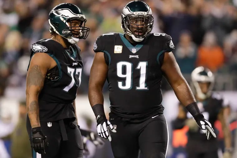 Fletcher Cox (right) has never played against Adrian Peterson, but Michael Bennett (left) has in his previous stops.
