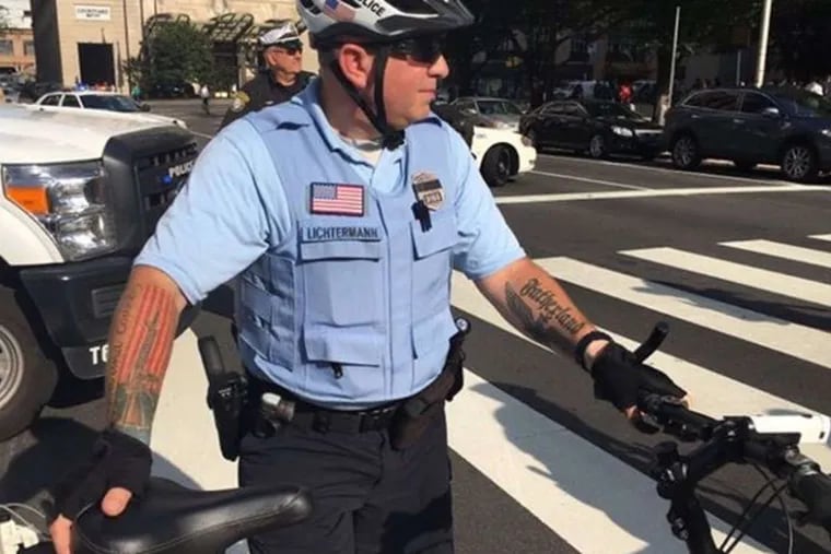 This photo of Officer Ian Lichterman, taken at a Democratic National Convention protest in July 2016, was posted on social media because of his tattoo of an eagle and the word "Fatherland."