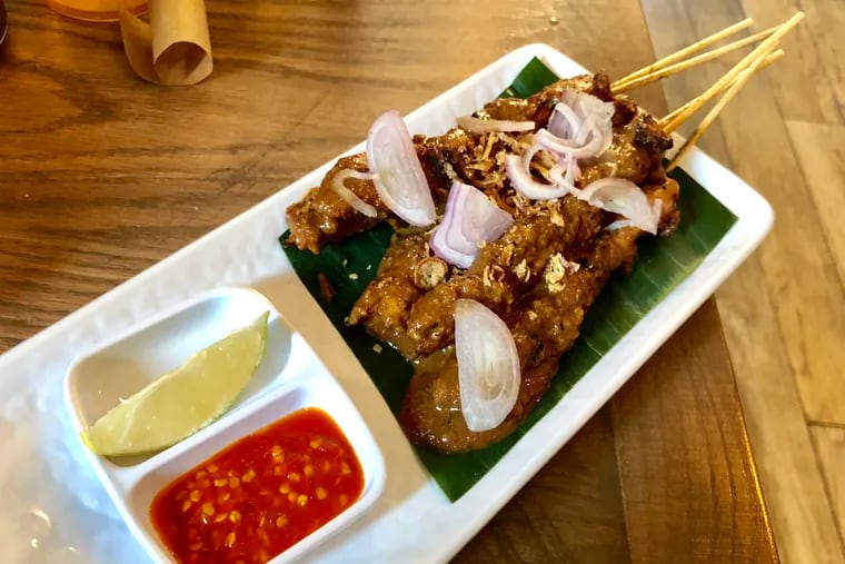 The chicken satay at D'Jakarta Cafe is similar to what chef Carerina Ho sold at her restaurants back home in Indonesia.