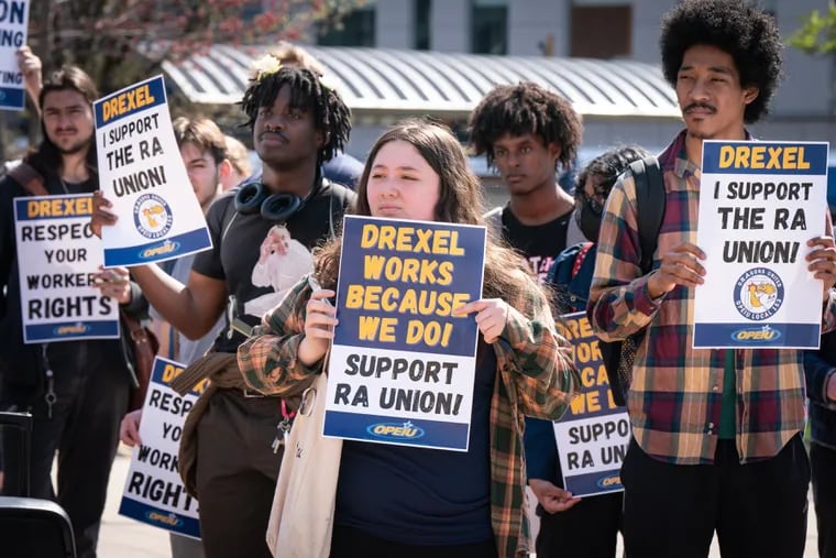 Drexel resident assistant Izzy Curtin (center) with other students at a protest Thursday supporting the RAs' effort to unionize.