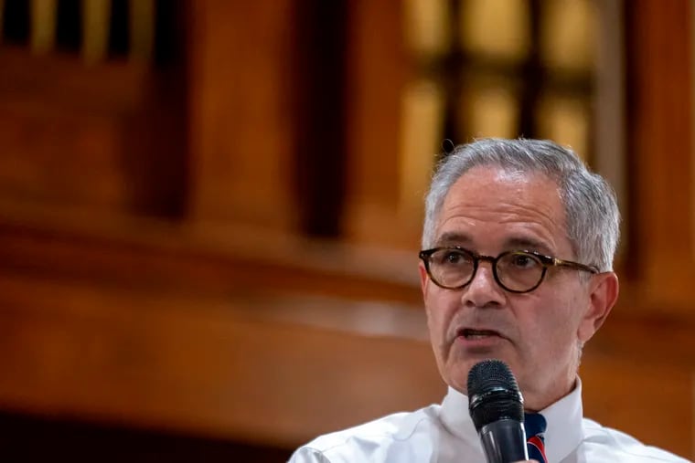 District Attorney Larry Krasner speaks at a September rally to protest efforts by Republicans to remove him from office. Three impeachment managers have been named.