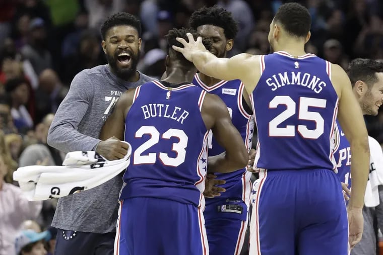 Jimmy Butler celebrated with teammates after his game-winning three-pointer in the 76ers' win at the Charlotte Hornets.