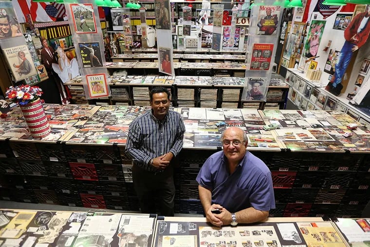 Fran DiBacco (right) created a nostalgia and pop-culture exhibit in Paulsboro out of his collection of vintage magazines and ads, with help from Kamal Kishore (left). &quot;I turned a hobby into a business,&quot; he says. DAVID MAIALETTI / Staff Photographer