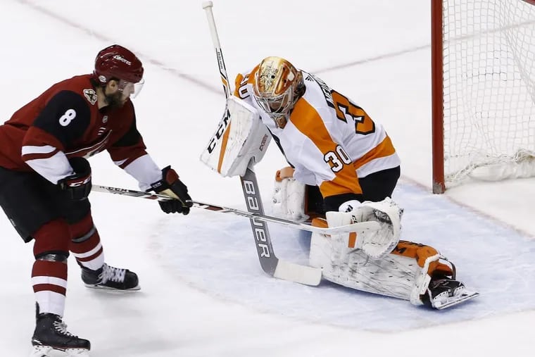 Flyers goaltender Michal Neuvirth, who came into the game for an injured Brian Elliott, makes a shootout save on Arizona’s Tobias Rieder during the Flyers’ 4-3 win Saturday.