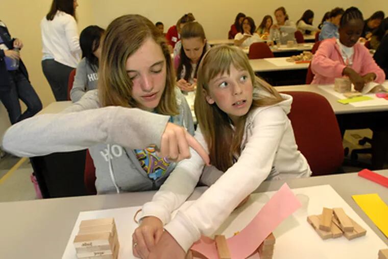 Emily Krowicki and Alexandra Johnson are part of a program that aims to interest girls in engineering, where demand is growing. (April Saul / Staff Photographer)
