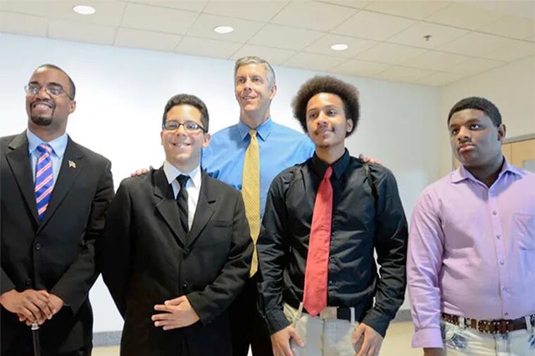 From left, students Jason Myers and Juan Cabrera, Education Secretary Arne Duncan, and students Nicholas Gross and Aneury Rodriguez after Friday's meeting.