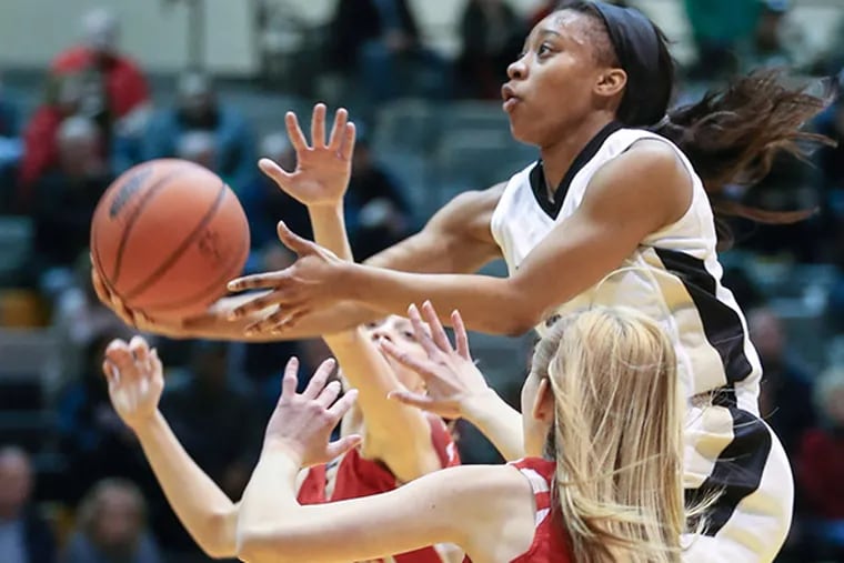 Neumann-Goretti's Sianni Martin over top of  Holy Redeemer's  defense during the 3rd quarter of the PIAA District 1 AA semifinals girls' basketball at Bethlehem Freedom, Tuesday, March 17, 2015. Neumann-Goretti beats Holy Redeemer 77-41. (Steven M. Falk/Staff Photographer)
