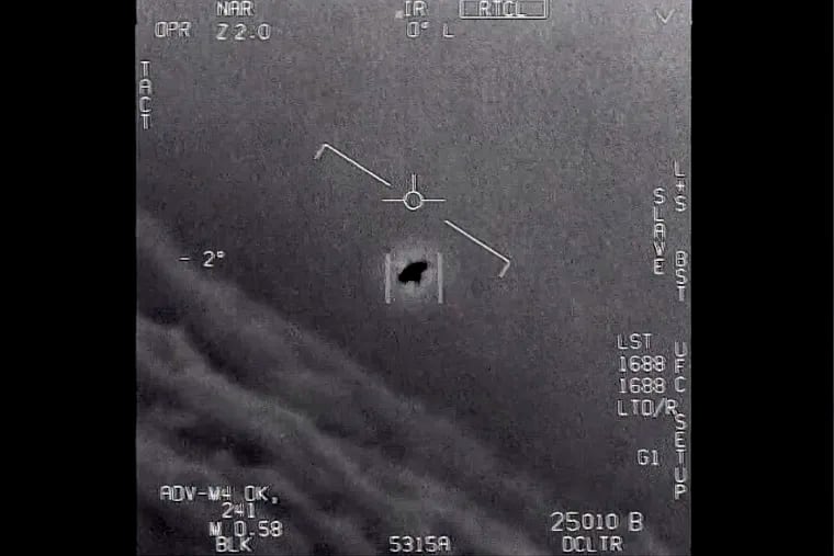The image from video provided by the Department of Defense called "Gimbal," from 2015. An unexplained object is tracked as it soars high along the clouds, traveling against the wind. (Department of Defense via AP)
