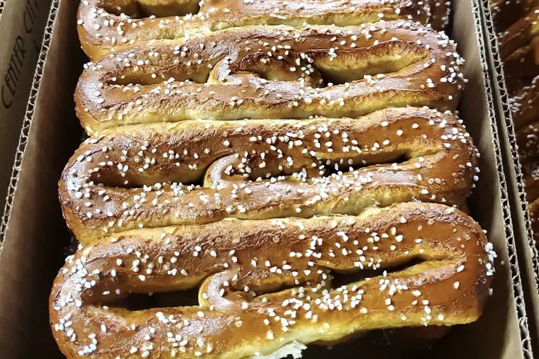 Center City Soft Pretzel Co. bakes thousands of pretzels daily at its shop at 816 Washington Ave.