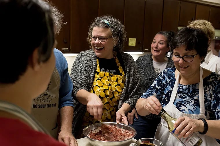 Barbara Thomas walks participants through a kimchi and applesauce recipe as part of her organization's fermentation and canning workshop in Collingswood, NJ on October 3, 2015. Thomas, who is a part of a grassroots movements, preaches the benefits of leading a GMO-free lifestyle. (ED NEWTON/For the Inquirer)