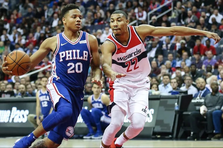 Sixers’ rookie guard Markelle Fultz drives on Wizards’ forward Otto Porter Jr. on Oct. 18.