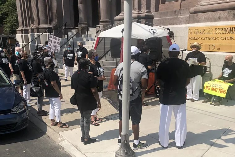 Members of St. Charles Borromeo Catholic Church, at 20th and Christian, protested outside the church on Sunday, July 5, 2020. They wore black T-shirts saying, "Our St. Charles Borromeo Parish lives matter." They contend the church administrator has ignored their concerns because they are Black.