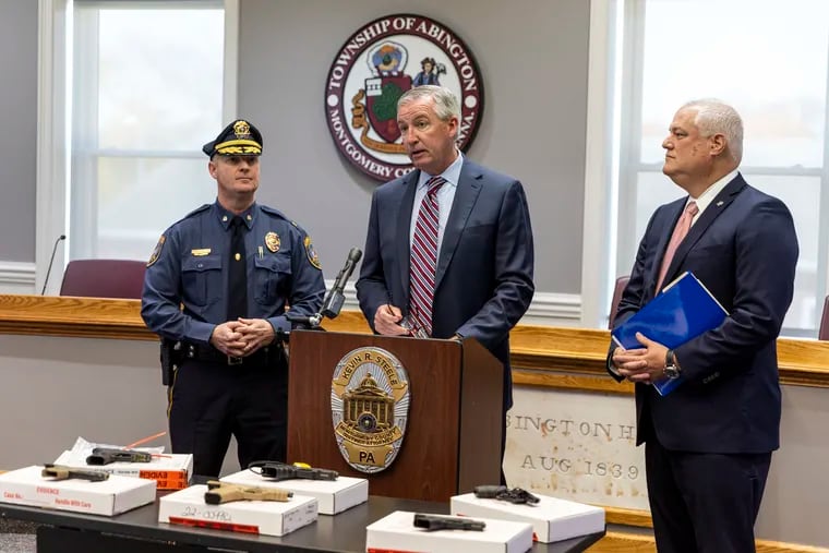 Montgomery County District Attorney Kevin R. Steele (center) along with Bucks County District Attorney Matt Weintraub (right) announced the arrests Thursday of five men involved in a three-county gun trafficking ring.