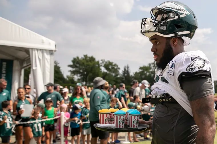 sEagles rookie Shareef Miller carries a tray of water ice at the conclusion of training camp at the NovaCare Complex in South Philadelphia on Saturday, Aug. 03, 2019