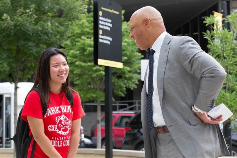 Thirteen-year-old Emma Lien shown, left,  here on her first day of class at Community College of Philadelphia, talking with Dr. William R. Hite, Superintendent of Philadelphia Schools, Tuesday, July 11, 2017, in Philadelphia. Lien is participating in a program for Philadelphia students who will be eligible to earn their high school diplomas and their associate’s degrees, for free. ( JESSICA GRIFFIN / Staff Photographer)