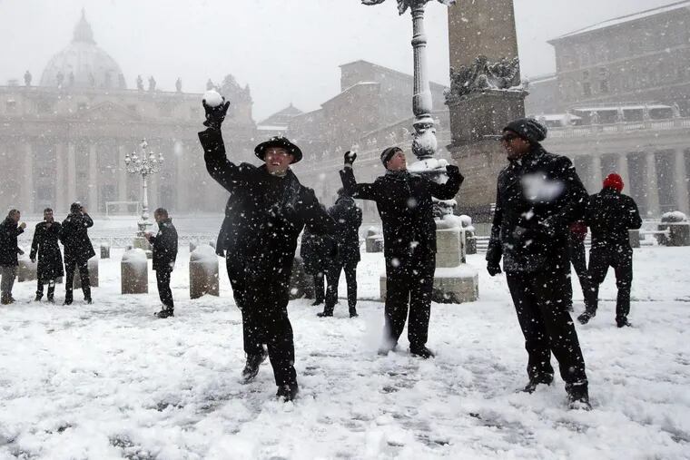 A student from Florida hurls a snowball at St. Peter’s Square on Monday.