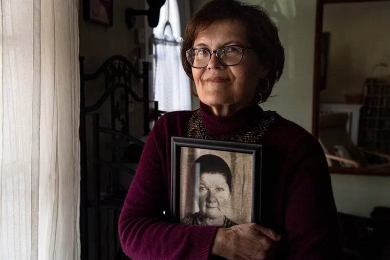 Mary Kalyna holds a photo of her grandmother Maria Hawryshkiw at her home in Philadelphia. Her grandparents were sent to Siberia by the Russians after WWII. Her grandmother did not survive. Today, Mary is a leader in the Ukrainian community in Philadelphia.