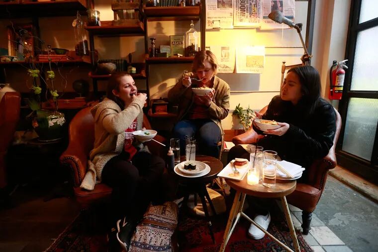 From lreft, Sophie Tibietti, 21, Catie Leasca, 21, and Jessica Lam, 21, dine at Double Knot, 120 S. 13th St.