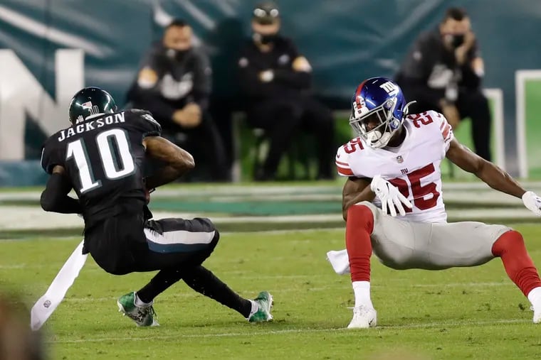 On this play, DeSean Jackson, reeling from a hit to the head by Corey Ballentine (right), was hit again by Madre Harper, breaking Jackson's right ankle.