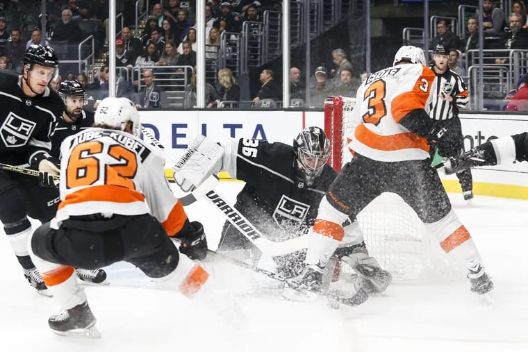 Los Angeles Kings goalie Jack Campbell (36) stops a shot by the  Flyers Nic Aube-Kubel (62) during the first period Thursday at the Staples Center.
