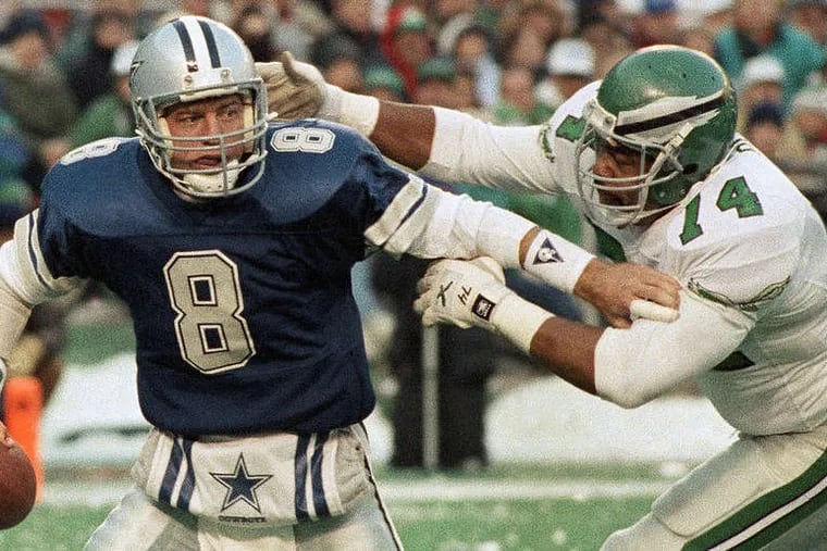Troy Aikman, here trying break free from Mike Pitts, started 23 games against the Eagles. He was 10-11 in the regular season, but 2-0 in the playoffs.