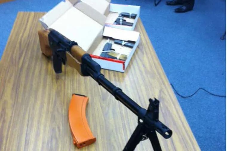 A replica AK-47 rifle and two working, World War II-vintage 9mm handguns
were confiscated from the bedroom of a Council Rock South High School
student on Thursday, after he allegedly threatened to kill students and staffers,
police said. (Bill Reed/Staff)