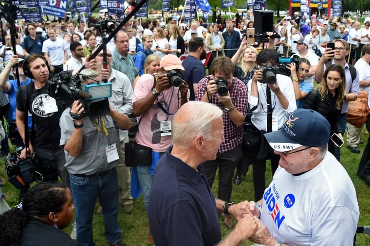 Former Vice President Joe Biden greets a supporter during his carnival-style "Biden fest" rally before marching to the stage at the Polk County Steak Fry, a huge gathering of Democrats in Des Moines, Iowa in September 2019.