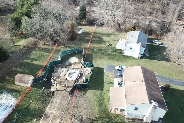 Crews fill sinkholes on March 3 in West Whiteland Township around Sunoco Pipeline’s Mariner East 1 pipeline, which state regulators temporarily shut down on March 7.