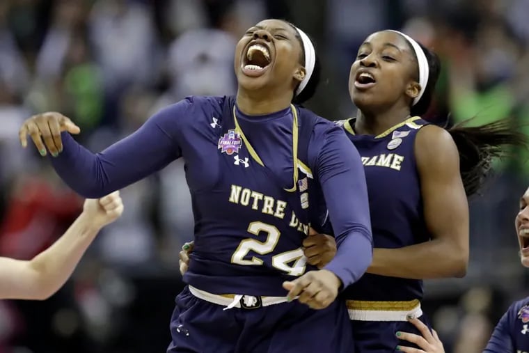 Notre Dame’s Arike Ogunbowale (lef), is congratulated by teammate Jackie Young after sinking a three-point basket to defeat Mississippi State, 61-58, in the final of the women’s NCAA Final Four college basketball tournament, Sunday, April 1, 2018, in Columbus, Ohio. (AP Photo/Tony Dejak)