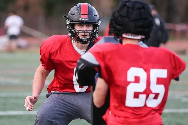 Haddonfield senior DL Gabe Klaus is about to block Mike DeFeo (25) during practice in Haddonfield, Thursday, November 30, 2017.
