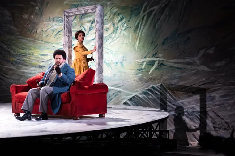 Kara Goodrich (back) performs as Mimì with Joshua Blue as Rodolfo in a dress rehearsal of Opera Philadelphia’s "La bohème" at the Academy of Music.