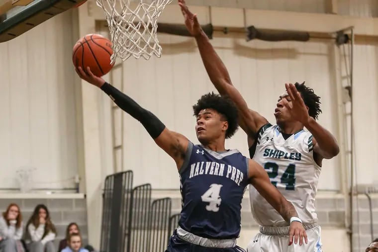 Malvern Prep's Deuce Turner goes to the basket with  Shipley's Ray Somerville during the 1st quarter in Bryn Mawr, Friday, December 14, 2018.   Shipley beats Malvern Prep 71-59. STEVEN M. FALK / Staff Photographer