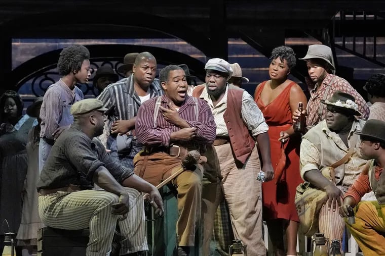 Eric Owens (center, in suspenders) sings the lead in Metropolitan Opera's season-opening production of "Porgy and Bess."