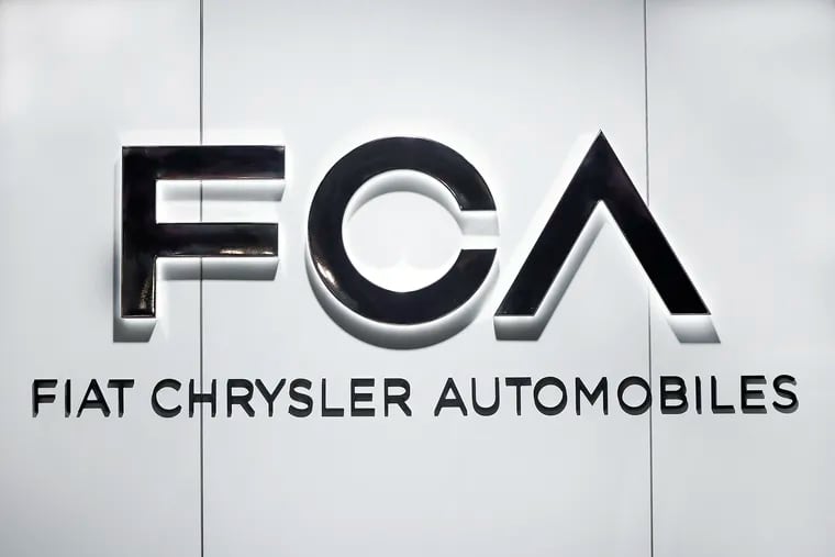 FILE - In this Monday, Jan. 14, 2019, file photo, the Fiat Chrysler Automobiles logo is shown at the North American International Auto Show in Detroit.