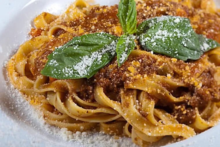 Tagliatelle Bolognese, egg-noodle pasta ribbons, tossed with Bolognese sauce and parmigiano reggiano cheese, as served at Fiorino. (David M Warren / Staff Photographer)