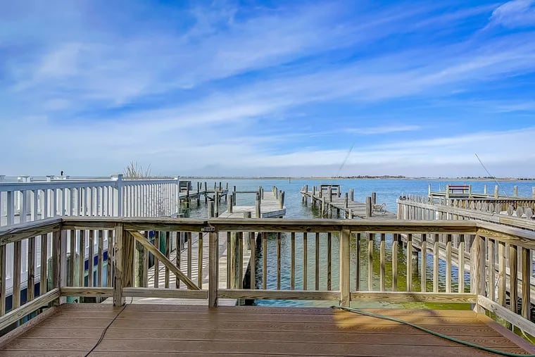 The house has a dock on the bay. “The sunsets are not to be missed,” the owner says.
