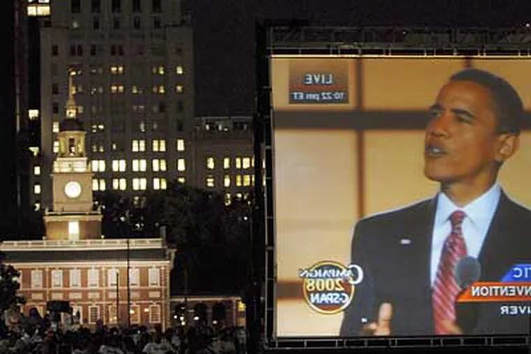 Crowds gathered last night at Independence Hall to watch Barack Obama's acceptance speech.  Many local African-American famiilies say that Obama's candidacy has become a turning point in their lives. (Bonnie Weller / Inquirer)