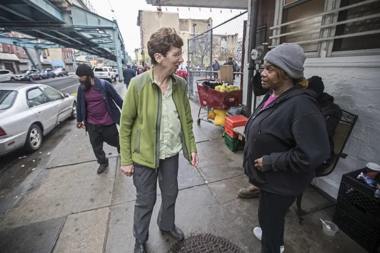 Mary Beth Appel, left, a nurse at the Catholic Worker Clinic in Kensington, talks with Arnetta Ferguson, right, who asked to be checked out physically while she was hanging out at the corner of Hagert and Kensington on Wednesday April 25, 2018.